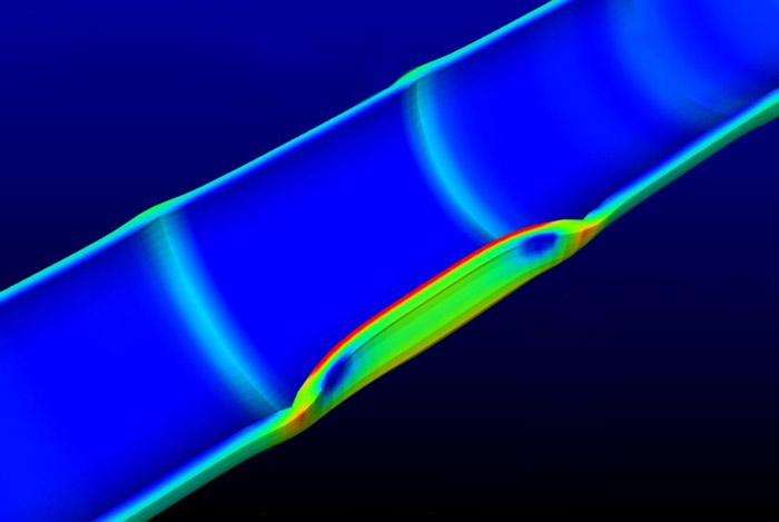 EPRI researchers used Phoebe to run tests on BISON-CASL, a new fuel performance analysis code. In this 3-D BISON-CASL image of a nuclear fuel rod section, the middle part of the section (colored red and green) has a defect known as missing pellet surface that can increase stress on the rod's outer layer. 