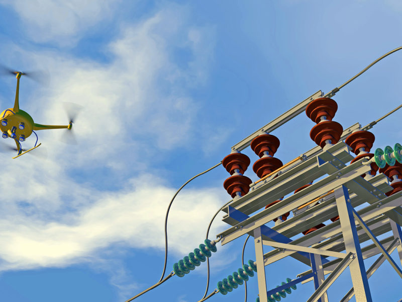 UAV drone in flight inspecting high-voltage electrical switchgear