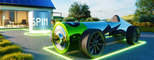 car shaped like a battery parked in front of a house connected to a SPIN device